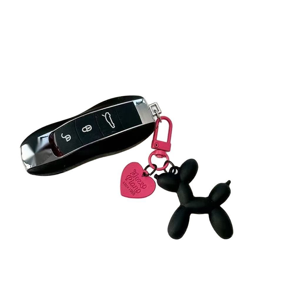 2-Piece Orange Balloon Dog Keychain Set with Heart Charm Bag Pendant